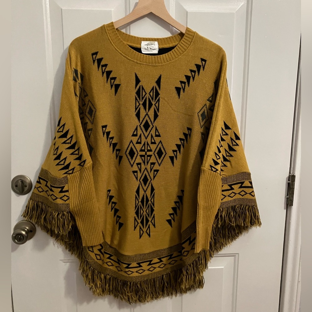 Unlimited- poncho , sweater with/ geometric patterns